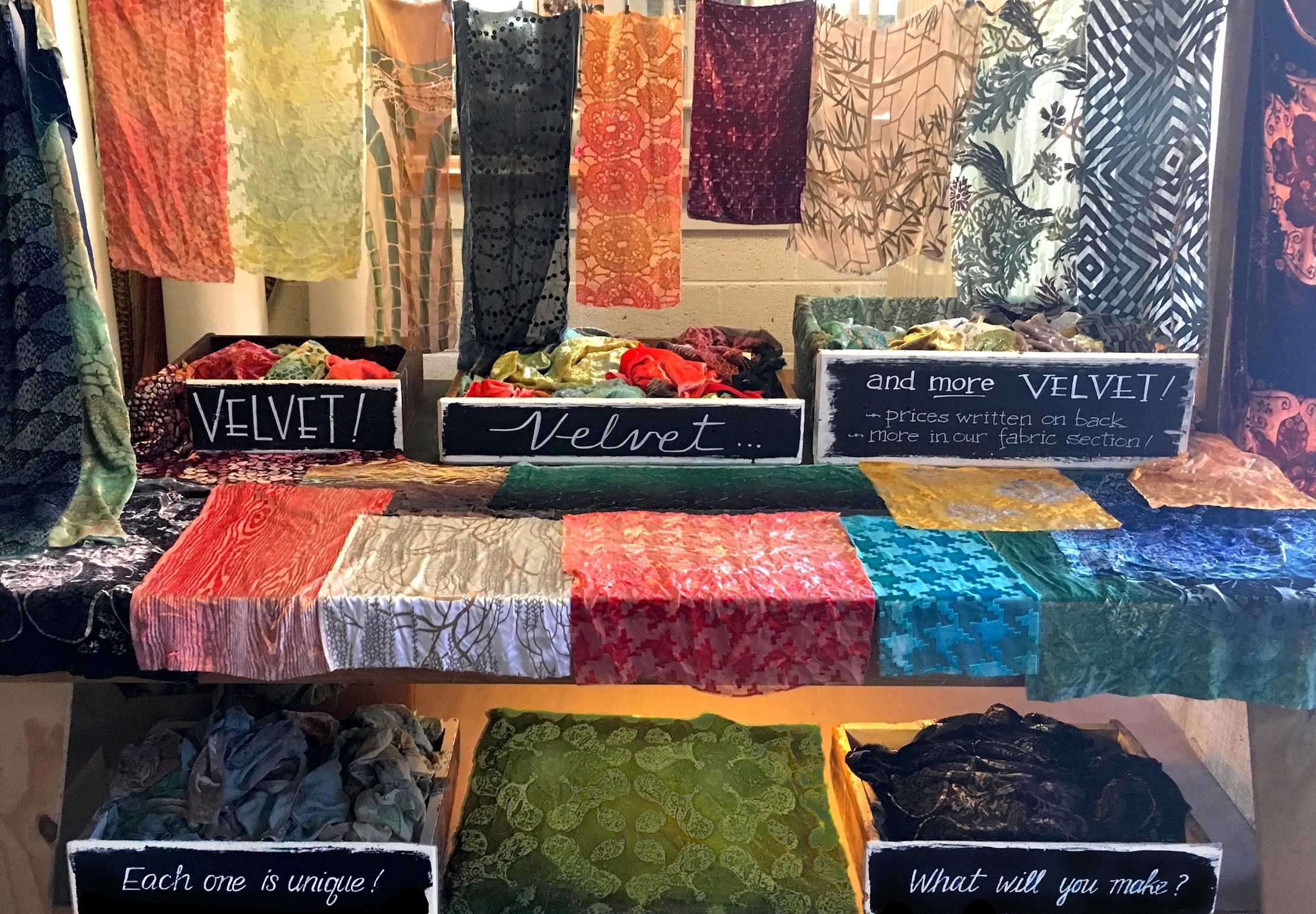 Colorful velvet textiles displayed on a table