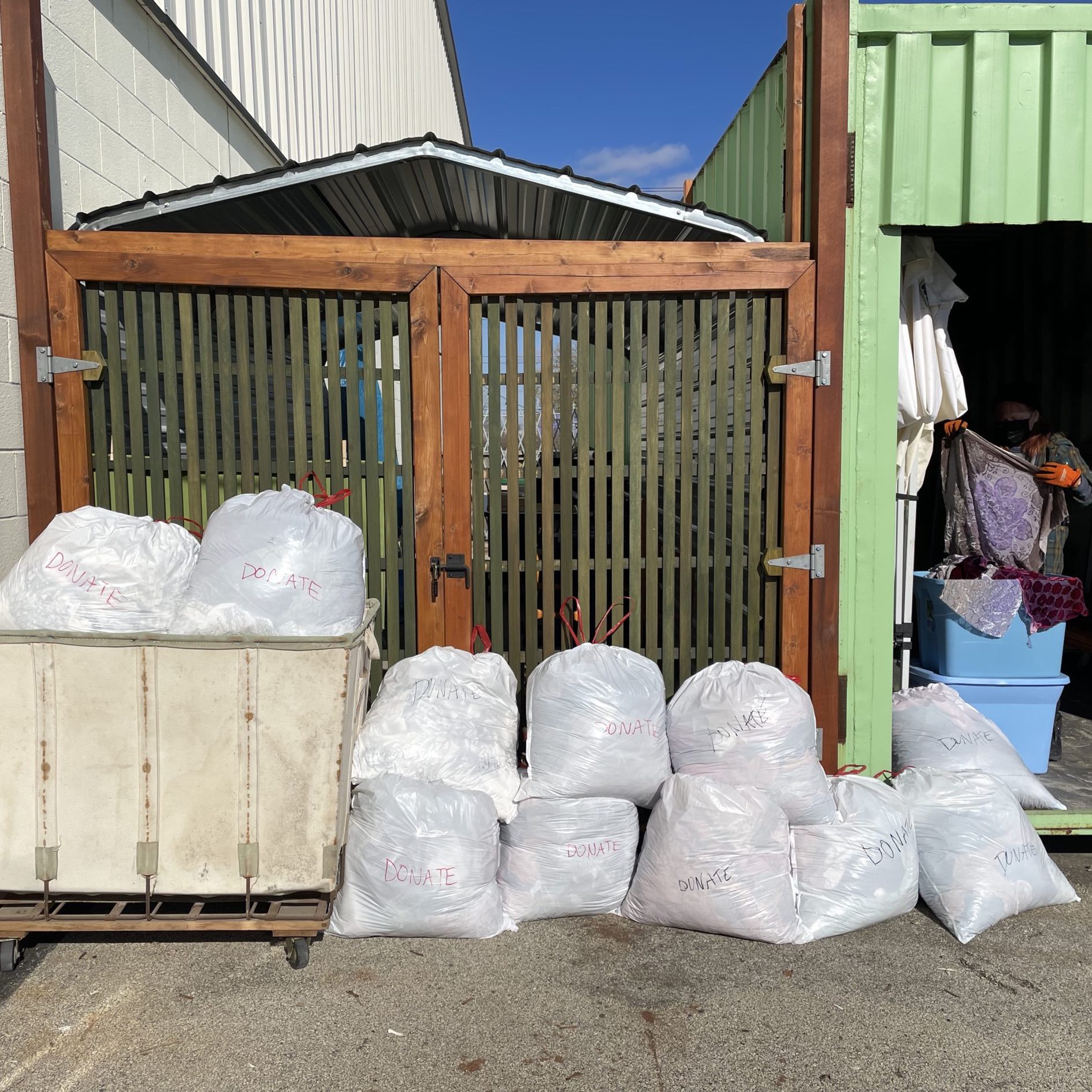 Donation of textiles outside with blue sky